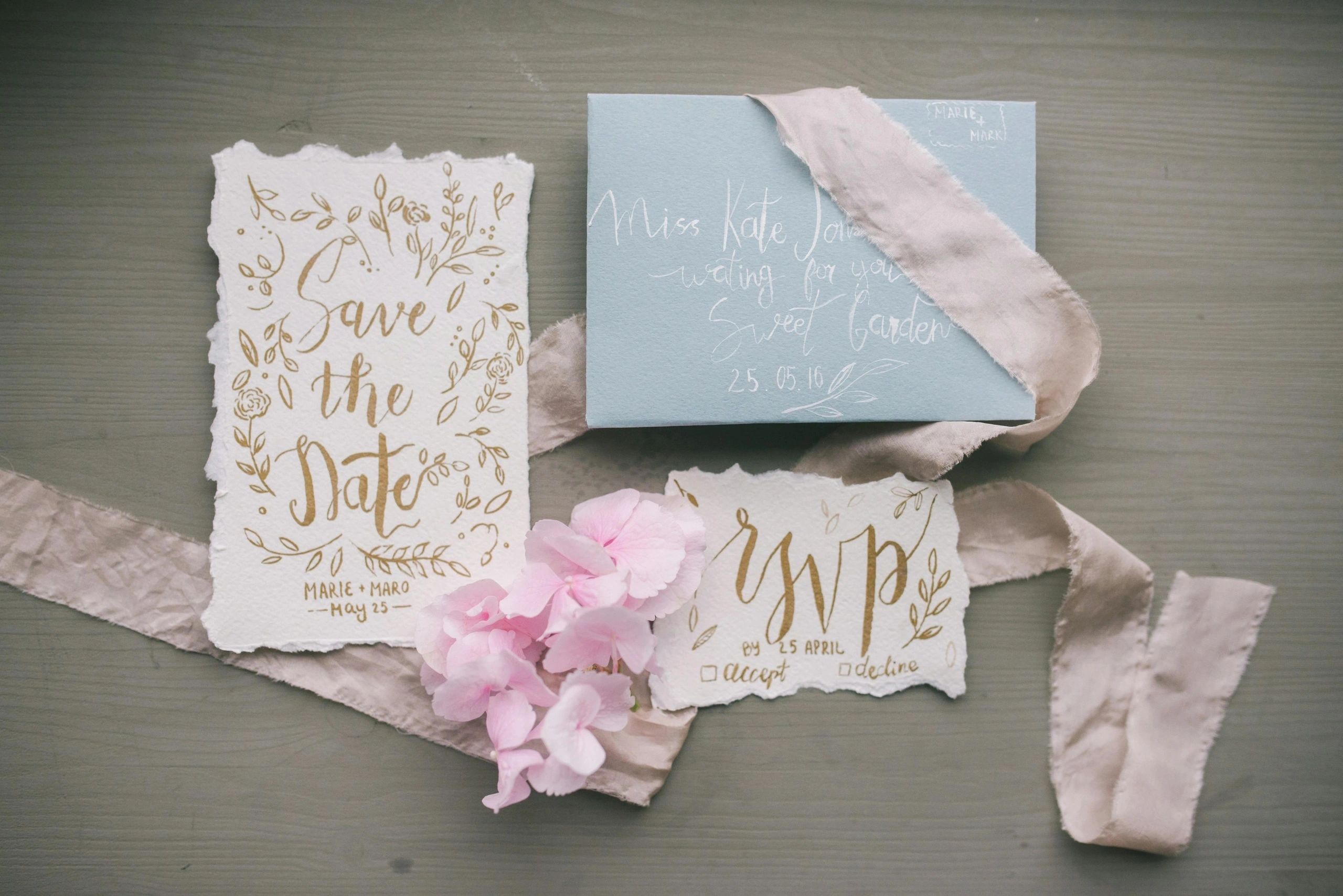 Pink wedding accessories and a decorative bride sign