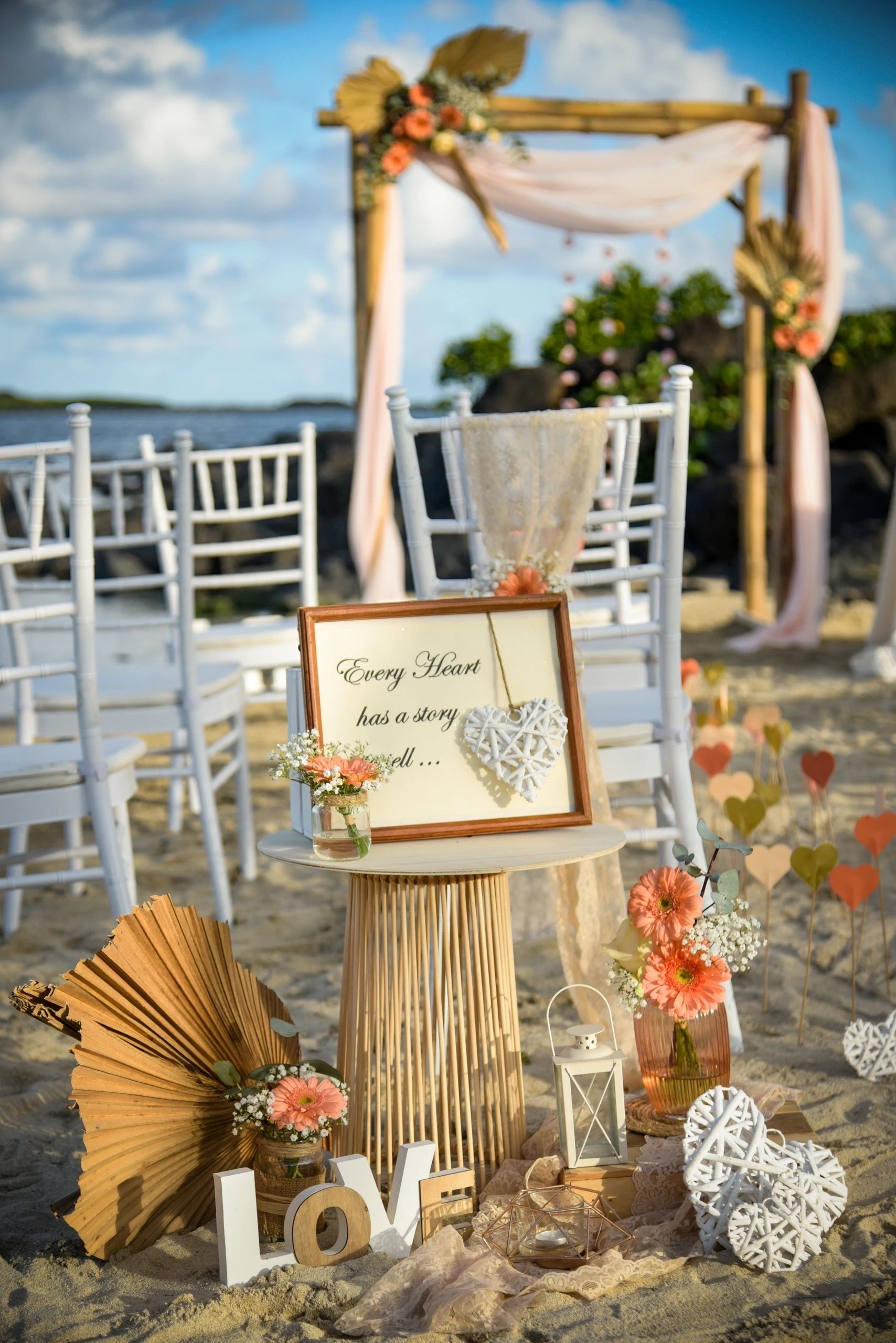 Rustic wedding welcome display with flowers and framed signs