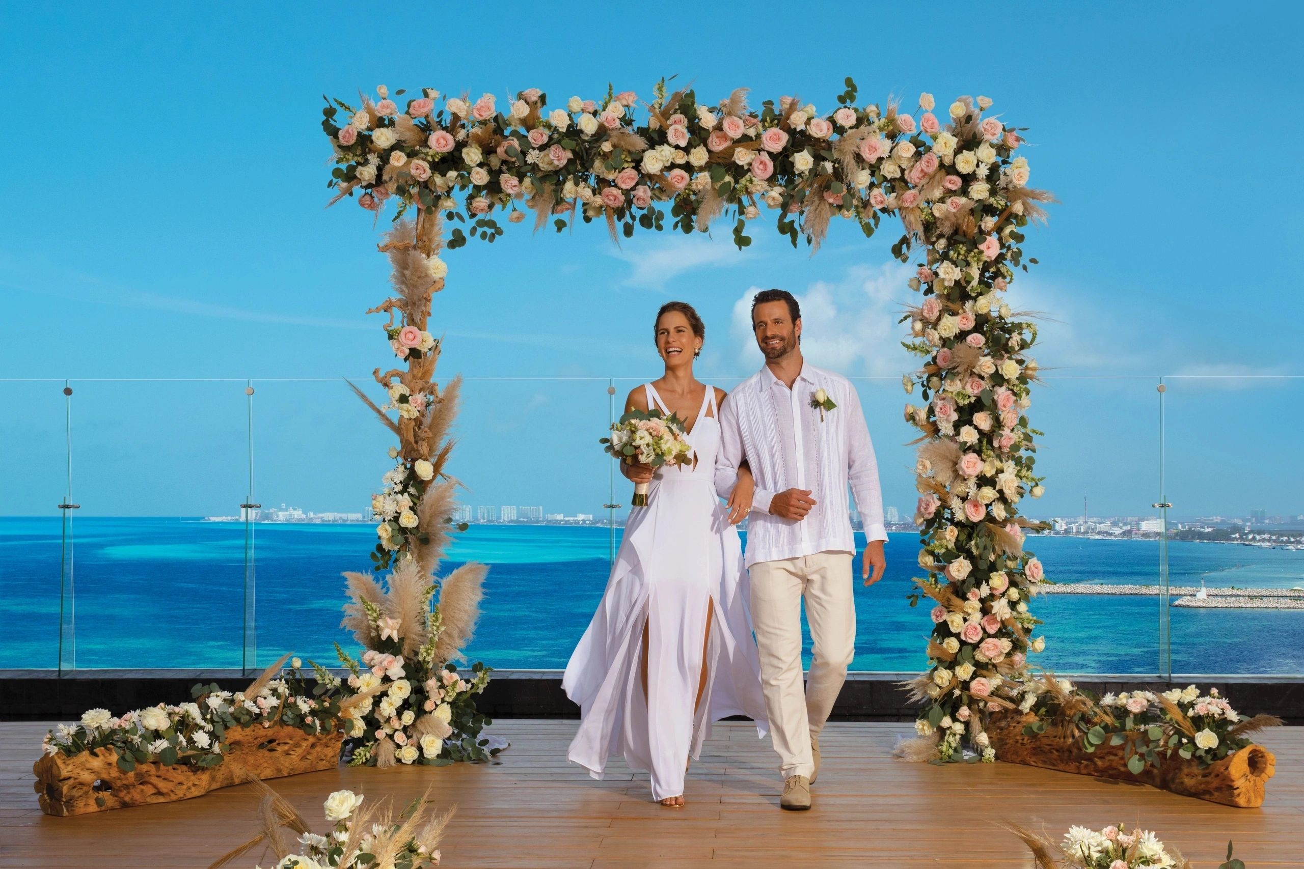 Couple getting married at Dreams Vista Cancun on preferred club terrace