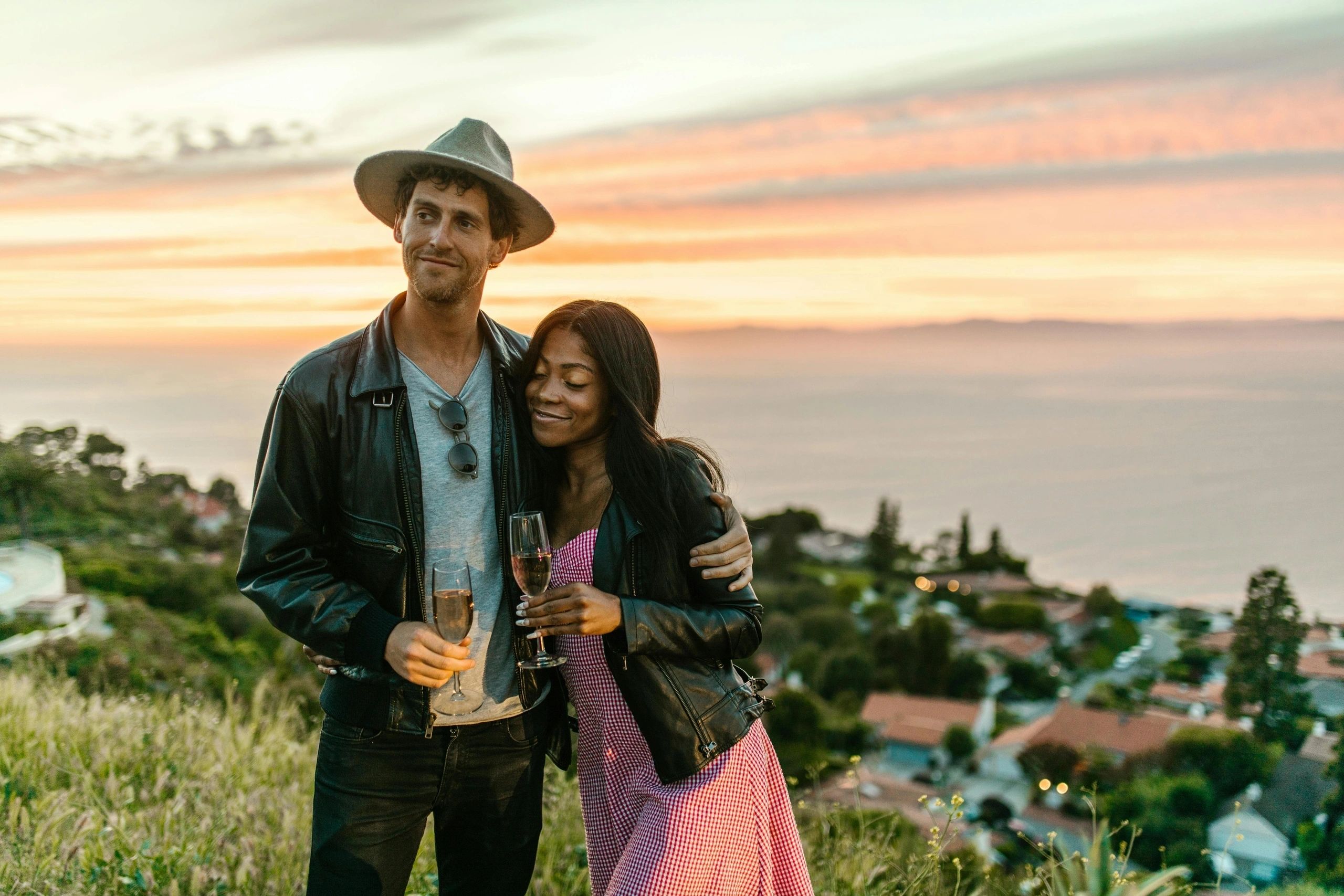 Honeymoon couple celebrating with wine