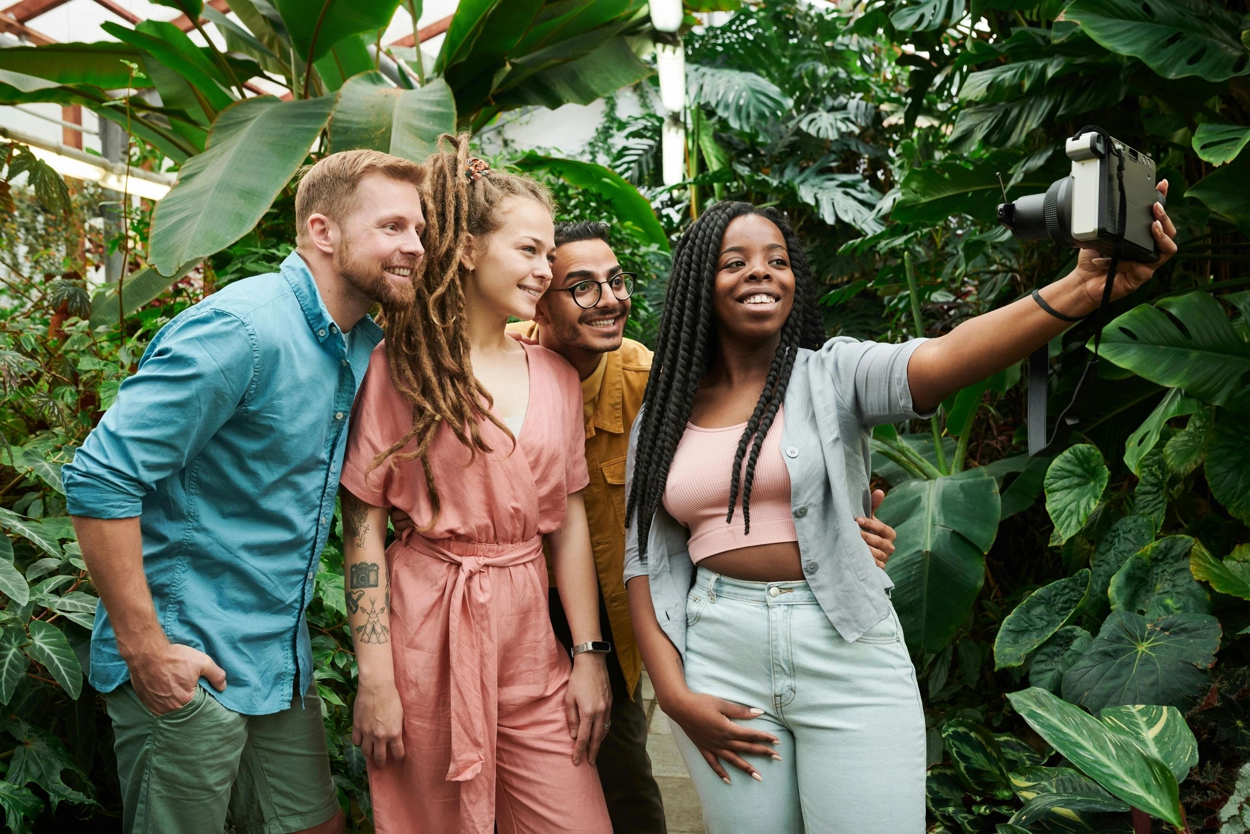 Friends taking a selfie among tropical plants