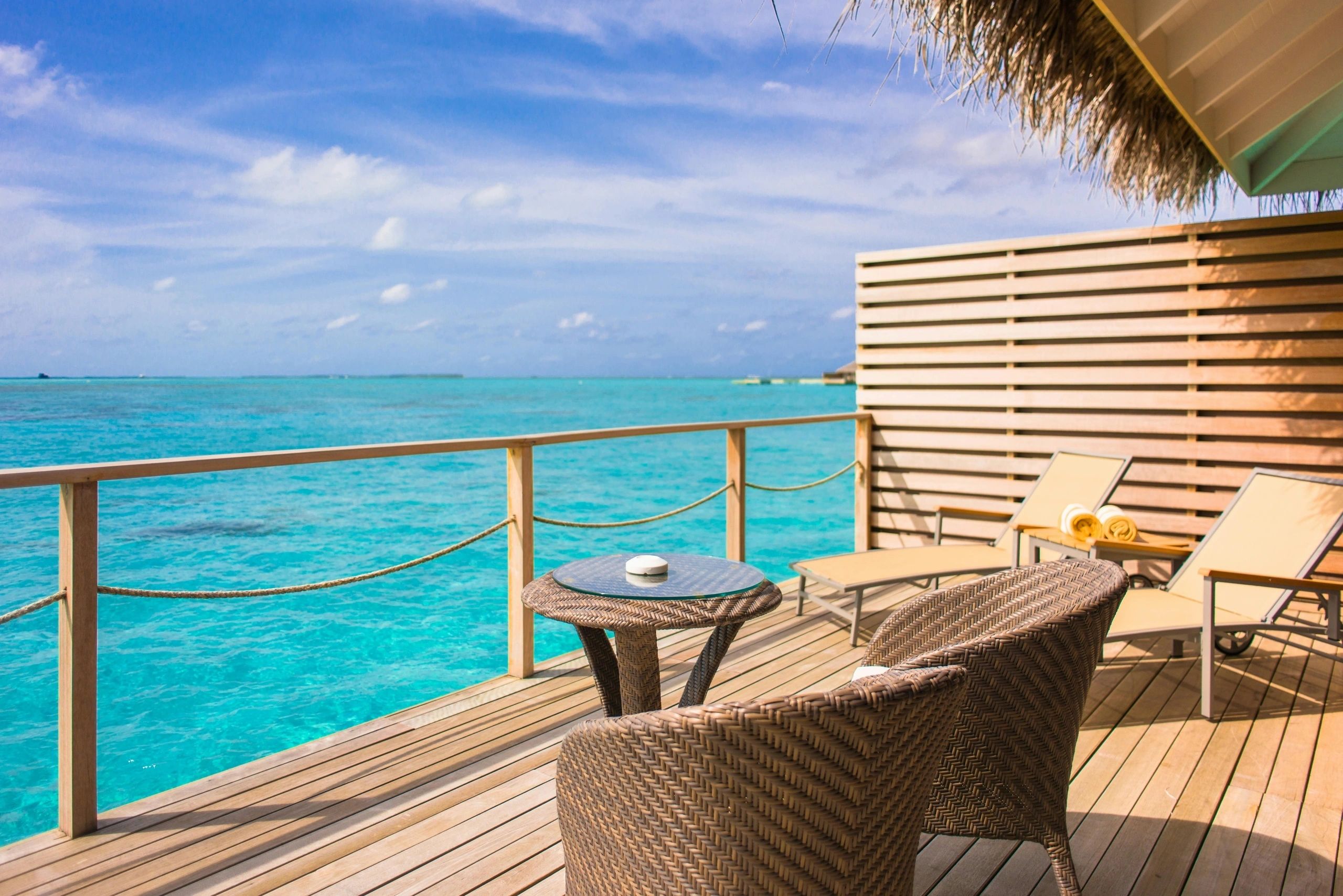 Romantic private balcony overlooking the blue ocean waters