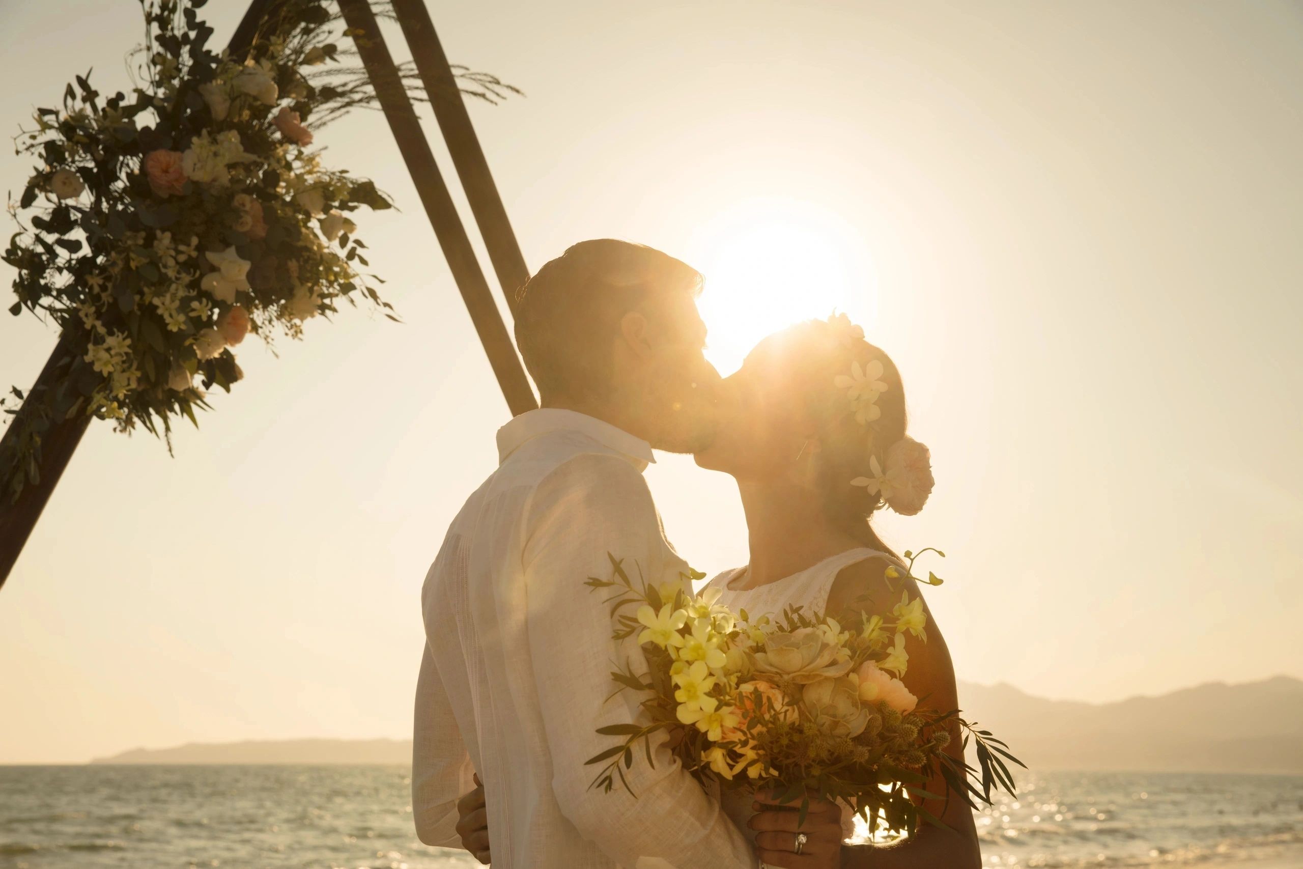 bride and groom at sunset Los Cabos