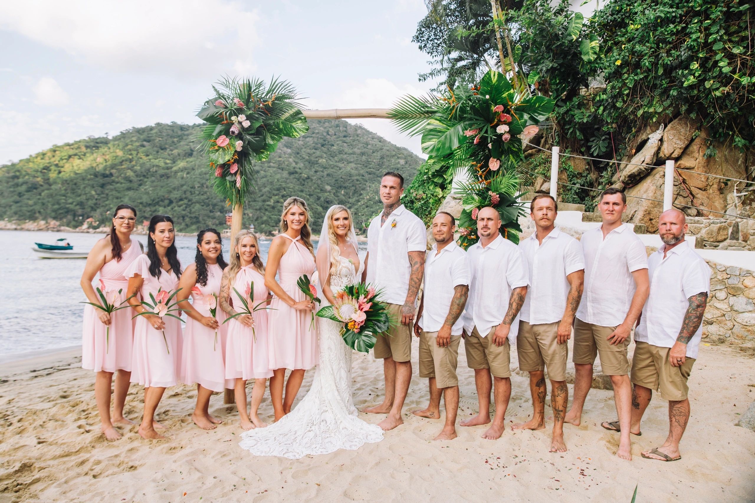 Beach Wedding in Puerto Vallarta, Mexico. Bride and groom with wedding party