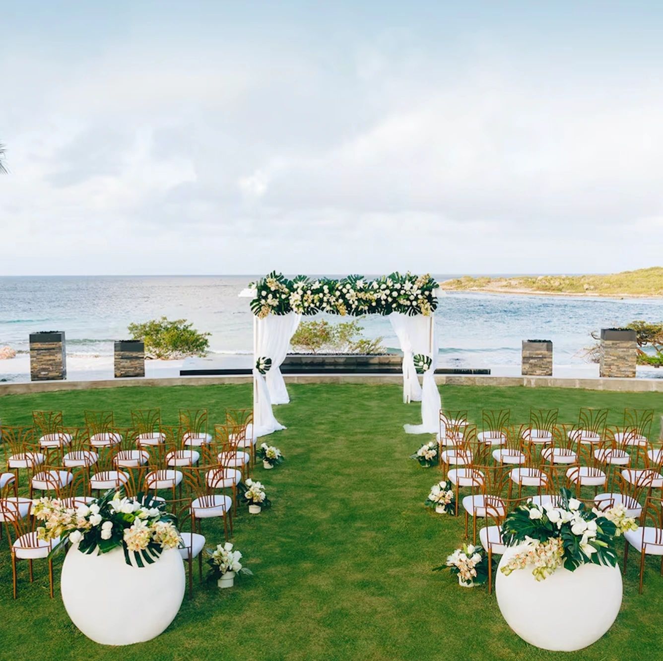 Garden wedding aisle overlooking the ocean