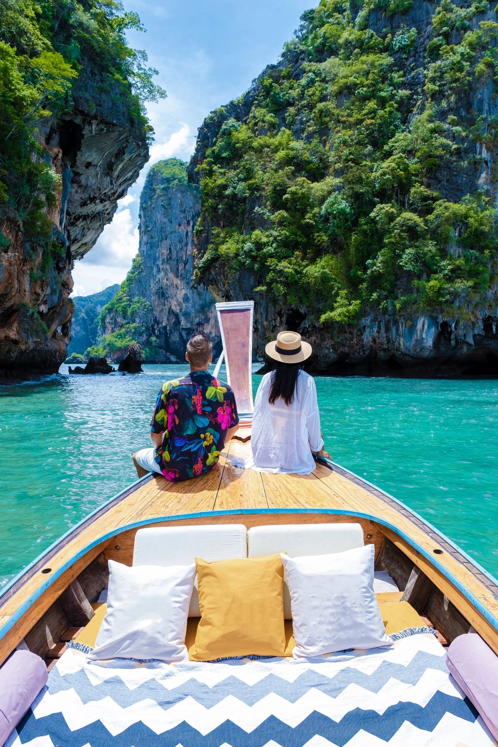 Luxury Longtail boat in Krabi Thailand, couple man, and woman on a trip to the tropical island 4 Island trip in Krabi Thailand