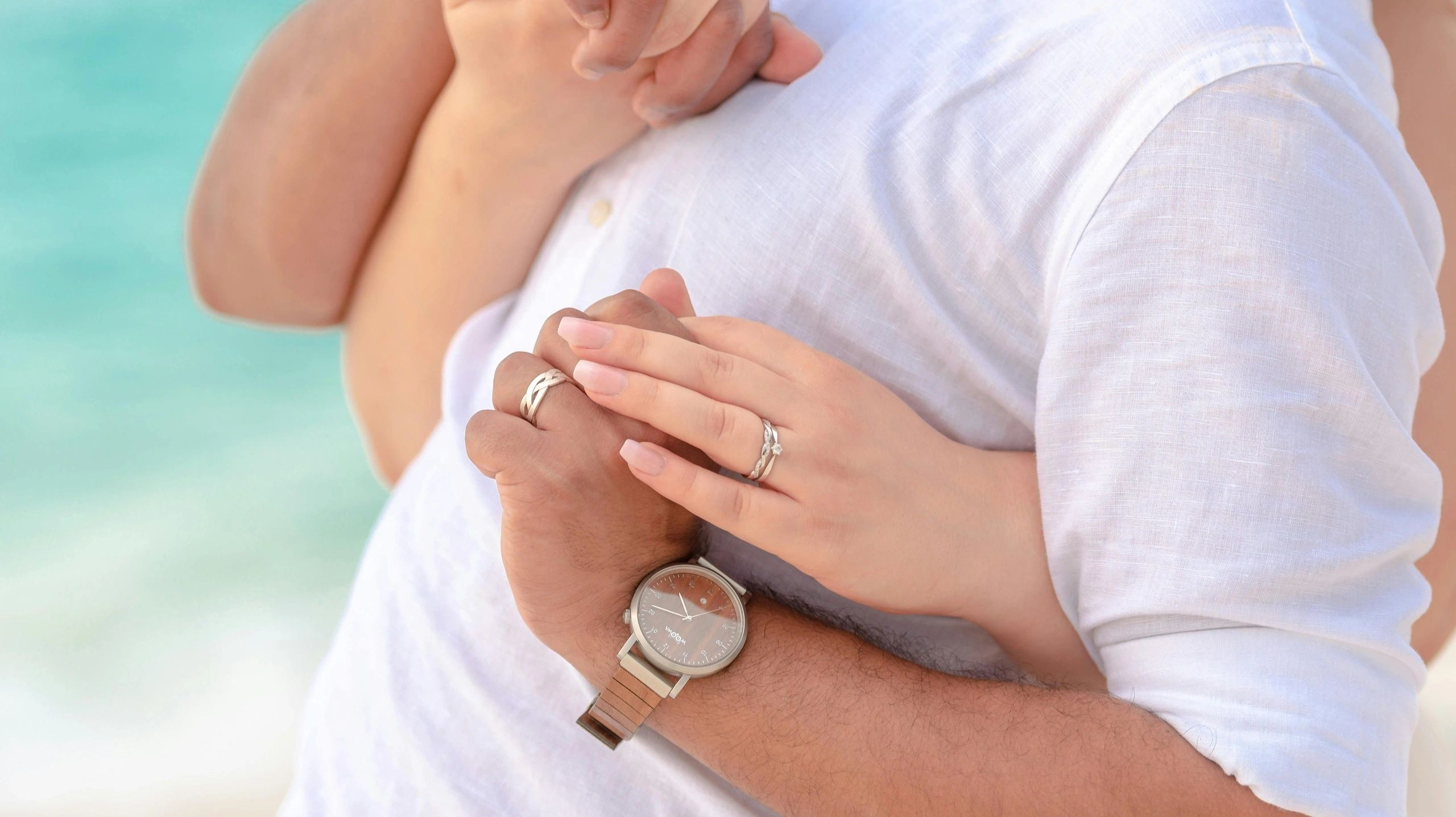 Honeymoon couple showing hands