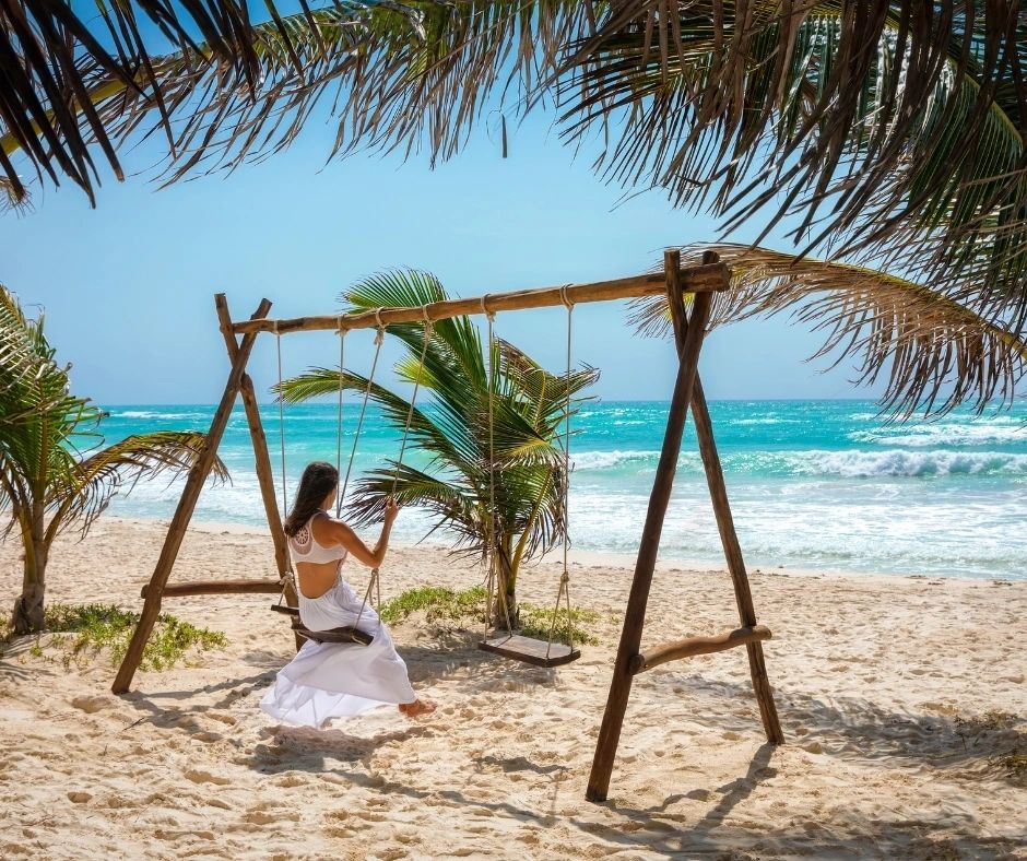 Bride on a swing in Tulum, Mexico