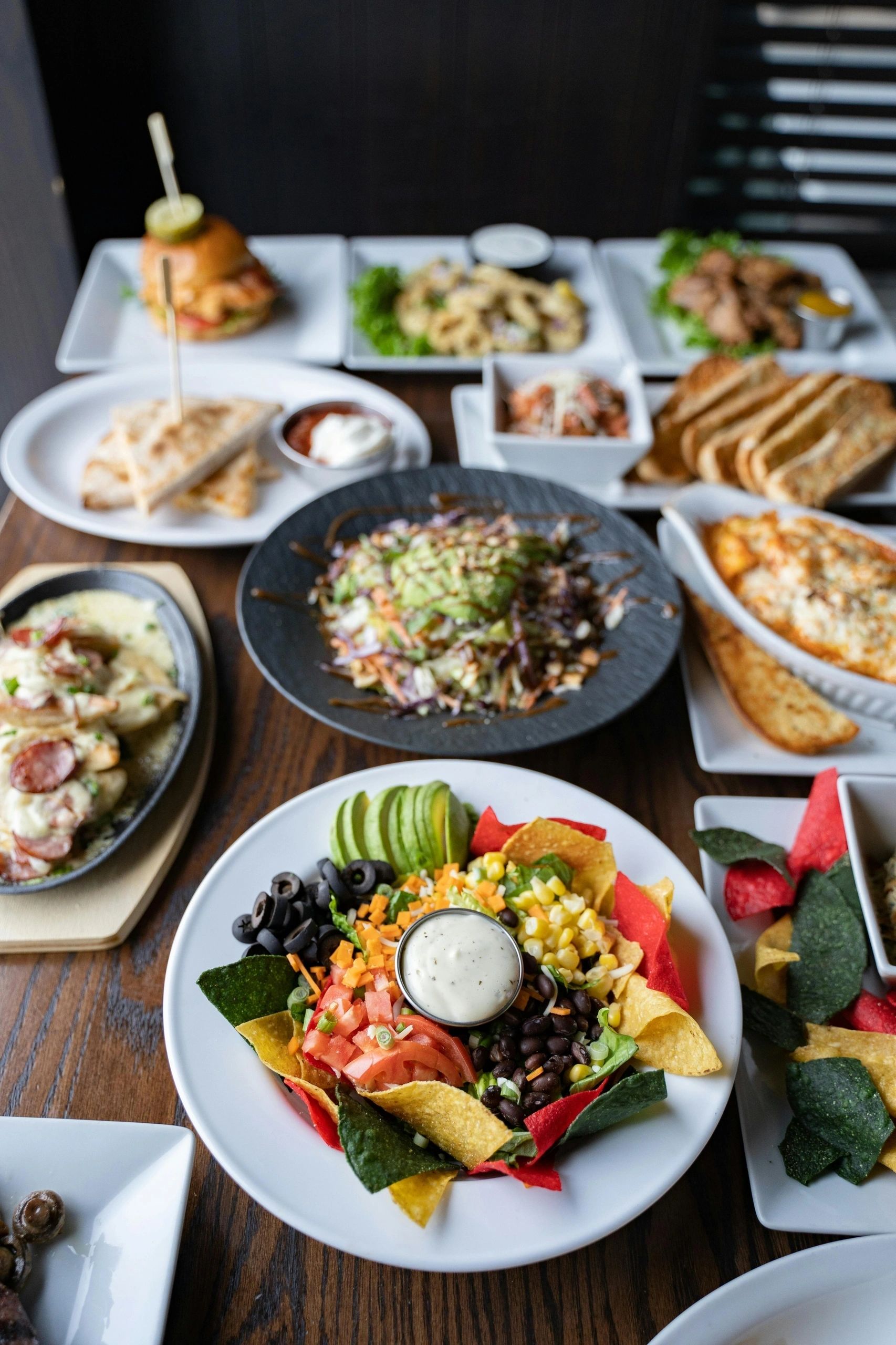 Table filled with colourful dishes and drinks
