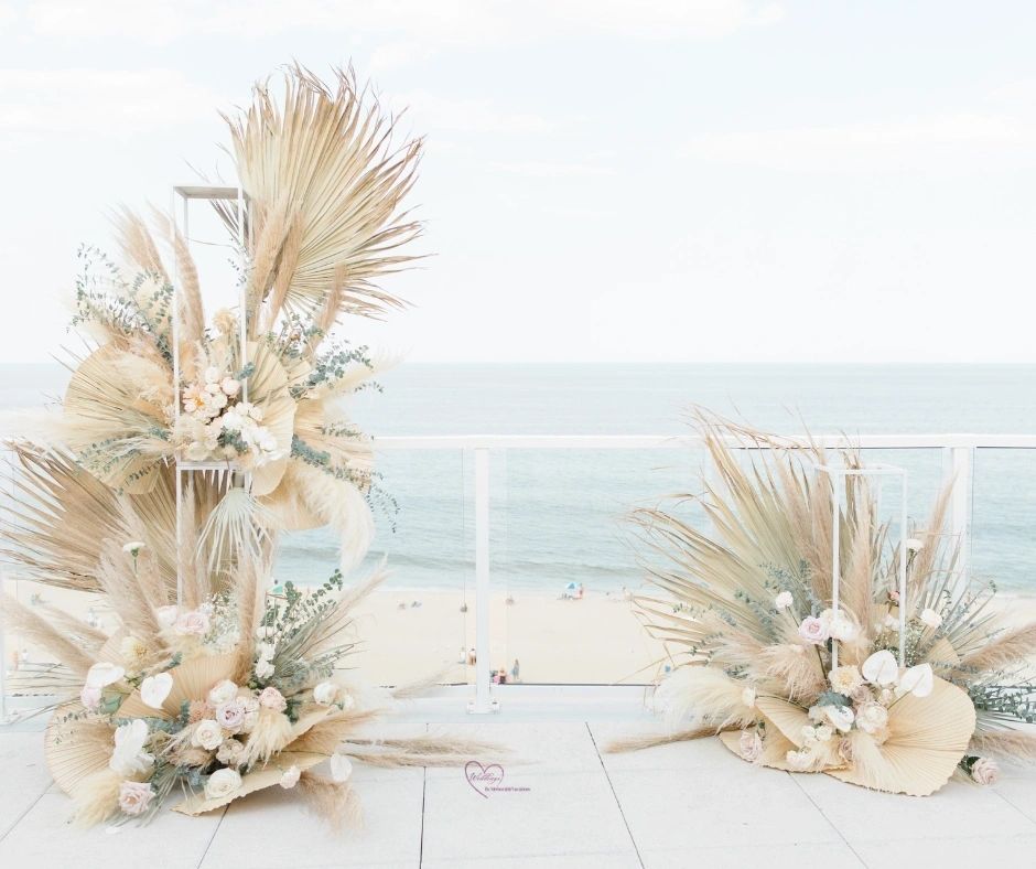 Neutral boho beach wedding decor with pampas grass